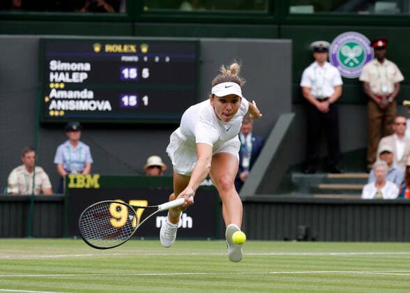 6th July 2022, All England Lawn Tennis and Croquet Club, London, England; Wimbledon Tennis tournament; Simona Halep (ROU) stretches to play a forehand to Amanda Anisimova (USA)  ActionPlus12405448 JohnxPatrickxFletcher