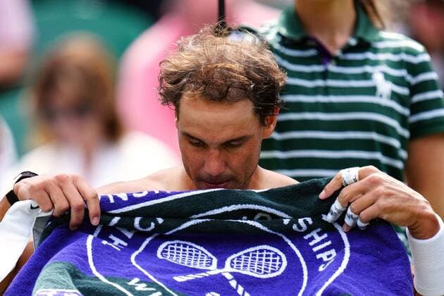 Mandatory Credit: Photo by Javier Garcia Shutterstock (13018042gj) Rafael Nadal with a Wimbledon towel during his quarter-final match Wimbledon Tennis Championships, Day 10, The All England Lawn Tennis and Croquet Club, London, UK - 06 Jul 2022 Wimbledon Tennis Championships, Day 10, The All England Lawn Tennis and Croquet Club, London, UK - 06 Jul 2022  Copyright: xJavierxGarcia Shutterstockx 13018042gj