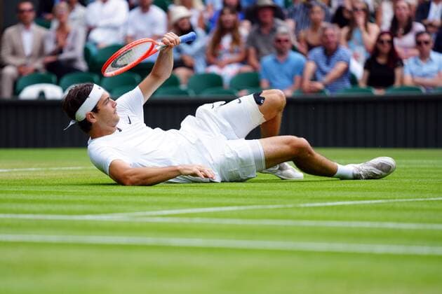 Mandatory Credit: Photo by Javier Garcia Shutterstock (13018042gl) Taylor Fritz plays a shot on the ground during his quarter-final match Wimbledon Tennis Championships, Day 10, The All England Lawn Tennis and Croquet Club, London, UK - 06 Jul 2022 Wimbledon Tennis Championships, Day 10, The All England Lawn Tennis and Croquet Club, London, UK - 06 Jul 2022  Copyright: xJavierxGarcia Shutterstockx 13018042gl