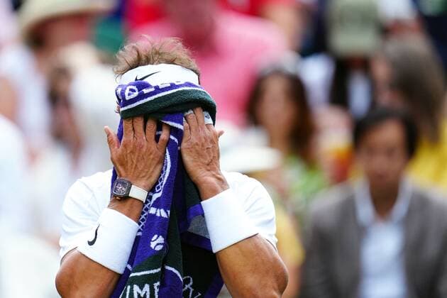 Mandatory Credit: Photo by Javier Garcia Shutterstock (13018042ho) Rafael Nadal with a towel over his face during his quarter-final match Wimbledon Tennis Championships, Day 10, The All England Lawn Tennis and Croquet Club, London, UK - 06 Jul 2022 Wimbledon Tennis Championships, Day 10, The All England Lawn Tennis and Croquet Club, London, UK - 06 Jul 2022  Copyright: xJavierxGarcia Shutterstockx 13018042ho