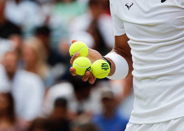 6th July 2022, All England Lawn Tennis and Croquet Club, London, England; Wimbledon Tennis tournament; Rafael Nadal (ESP) holding tennis balls before serving to Taylor Fritz (USA)  ActionPlus12405481 JohnxPatrickxFletcher