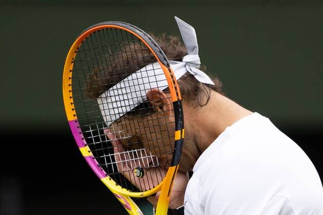 Mandatory Credit: Photo by Ella Ling Shutterstock (13018040cj) Rafael Nadal reacts during his quarter final match Wimbledon Tennis Championships, Day 10, The All England Lawn Tennis and Croquet Club, London, UK - 06 Jul 2022 Wimbledon Tennis Championships, Day 10, The All England Lawn Tennis and Croquet Club, London, UK - 06 Jul 2022  Copyright: xEllaxLing Shutterstockx 13018040cj