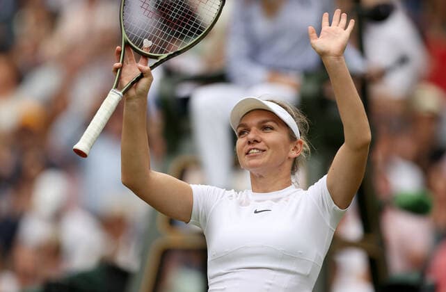 (220707) -- LONDON, July 7, 2022 -- Simona Halep of Romania celebrates after winning the women s singles quarter-final match against Amanda Anisimova of the United States at Wimbledon Tennis Championship in London, Britain, on July 6, 2022. ) (SP)BRITAIN-LONDON-TENNIS-WIMBLEDON-WOMEN S SINGLES-QUARTERFINALS LixYing 