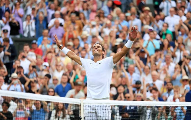 (220707) -- LONDON, July 7, 2022 -- Rafael Nadal of Spain celebrates after winning the men s singles quarter-final match against Taylor Fritz of the United States at Wimbledon Tennis Championship in London, Britain, on July 6, 2022. ) (SP)BRITAIN-LONDON-TENNIS-WIMBLEDON-MEN S SINGLES-QUARTERFINALS LixYing 