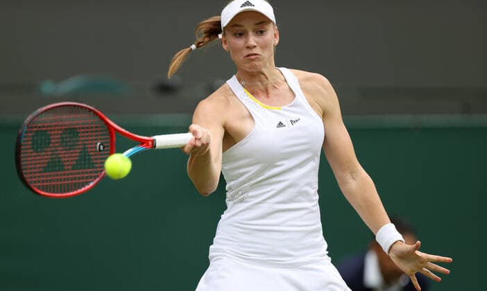 (220707) -- LONDON, July 7, 2022 -- Elena Rybakina of Kazakhstan hits a return during the women s singles quarter-final match against Ajla Tomljanovic of Australia at Wimbledon Tennis Championship in London, Britain, on July 6, 2022. ) (SP)BRITAIN-LONDON-TENNIS-WIMBLEDON-WOMEN S SINGLES-QUARTERFINALS LixYing 