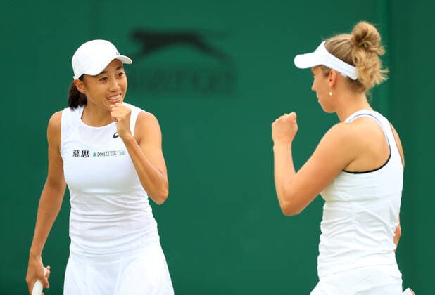 (220707) -- LONDON, July 7, 2022 -- China s Zhang Shuai (L) Belgium s Elise Mertens react during the women s doubles quarter-final match against Slovenia s Andreja Klepac Chile s Alexa Guarachi at Wimbledon Tennis Championship in London, Britain, on July 6, 2022. ) (SP)BRITAIN-LONDON-TENNIS-WIMBLEDON-WOMEN S DOUBLES-QUARTERFINALS LixYing 