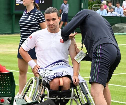Tennis Championships - Week One - Day Eleven - All England Lawn Tennis Club, Wimbledon - Thursday 7th July 2022 Mens Wheelchair Singles. Gordon Reid (GBR) v Alfie Hewett (GBR) Gordon Reid receives attention for an arm injury 