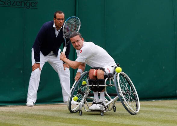 7th July 2022, All England Lawn Tennis and Croquet Club, London, England; Wimbledon Tennis tournament; Gordon Reid (GBR) plays a backhand to Alfie Hewett (GBR) in mens wheelchair quarter-final match  ActionPlus12405637 JohnxPatrickxFletcher