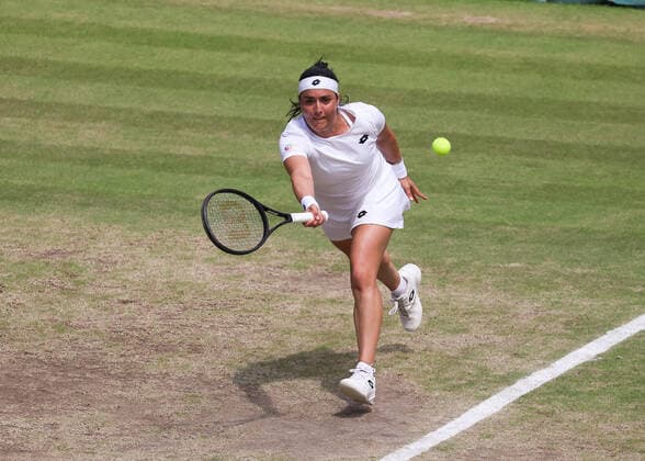 7th July 2022, All England Lawn Tennis and Croquet Club, London, England; Wimbledon Tennis tournament; Ons Jabeur (TUN) plays a forehand to Tatjana Maria (GER) in the womens singles semi-final  ActionPlus12405668 JohnxPatrickxFletcher