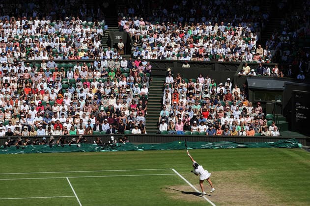 7th July 2022, All England Lawn Tennis and Croquet Club, London, England; Wimbledon Tennis tournament; Ons Jabeur (TUN) serves to Tatjana Maria (GER) in front of a packed Centre Court  ActionPlus12405693 JohnxPatrickxFletcher