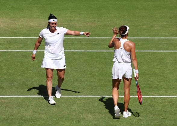 7th July 2022, All England Lawn Tennis and Croquet Club, London, England; Wimbledon Tennis tournament; Ons Jabeur (TUN) points to Tatjana Maria (GER) after defeating the German in 3 sets to reach the final  ActionPlus12405683 JohnxPatrickxFletcher