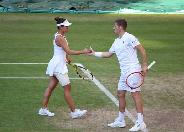 7th July 2022, All England Lawn Tennis and Croquet Club, London, England; Wimbledon Tennis tournament; Neal Skupski (GBR) with mixed doubles parter Desirae Krawczyk (USA) as they retain their mixed doubles title  ActionPlus12405767 JohnxPatrickxFletcher