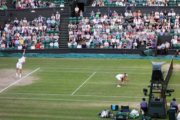 7th July 2022, All England Lawn Tennis and Croquet Club, London, England; Wimbledon Tennis tournament; Neal Skupski (GBR) serves to Samantha Stosur (AUS) as they retain their mixed doubles title  ActionPlus12405773 JohnxPatrickxFletcher