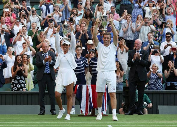 7th July 2022, All England Lawn Tennis and Croquet Club, London, England; Wimbledon Tennis tournament; Neal Skupski (GBR) and Desirae Krawczyk (USA) lift the Mixed Doubles Trophy after defeating Samantha Stosur (AUS) and Matthew Ebden (AUS) in two sets  ActionPlus12405775 JohnxPatrickxFletcher