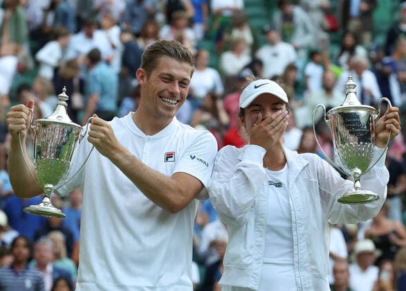 7th July 2022, All England Lawn Tennis and Croquet Club, London, England; Wimbledon Tennis tournament; Neal Skupski (GBR) and Desirae Krawczyk (USA) lift the Mixed Doubles Trophy after defeating Samantha Stosur (AUS) and Matthew Ebden (AUS) in two sets  ActionPlus12405776 JohnxPatrickxFletcher