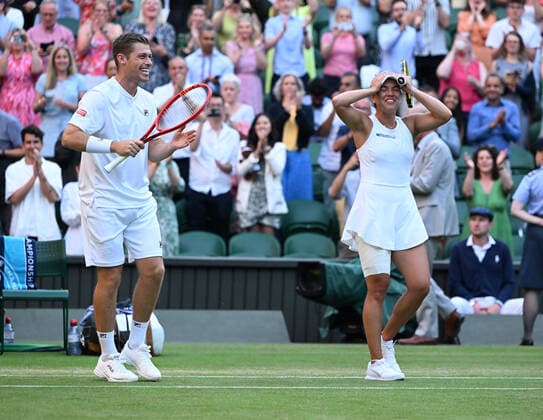Tennis Championships - Week One - Day Eleven - All England Lawn Tennis Club, Wimbledon - Thursday 7th July 2022 Mixed Doubles Final - Centre Court Neal Skupski (GBR) and Desirae Krawczyk (USA) v Matthew Ebden and Samantha Sposur (AUS) Neal Skupski (GBR) and Desirae Krawczyk (USA) celebrate winning the match 