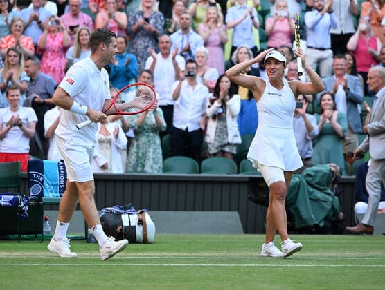 Tennis Championships - Week One - Day Eleven - All England Lawn Tennis Club, Wimbledon - Thursday 7th July 2022 Mixed Doubles Final - Centre Court Neal Skupski (GBR) and Desirae Krawczyk (USA) v Matthew Ebden and Samantha Sposur (AUS) Neal Skupski (GBR) and Desirae Krawczyk (USA) celebrate winning the match 