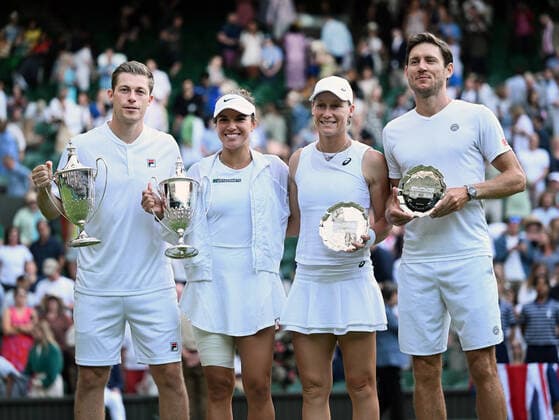 Tennis Championships - Week One - Day Eleven - All England Lawn Tennis Club, Wimbledon - Thursday 7th July 2022 Mixed Doubles Final - Centre Court Neal Skupski (GBR) and Desirae Krawczyk (USA) v Matthew Ebden and Samantha Sposur (AUS) Winners - Neal Skupski (GBR) and Desirae Krawczyk (USA) and runners up, Matthew Ebden and Samantha Sposur (AUS) with their trophies and plates 