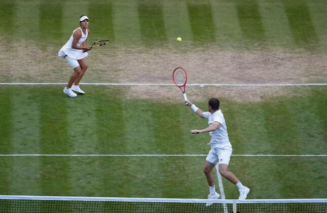 (220708) -- LONDON, July 8, 2022 -- Neal Skupski (R) of Great Britain and Desirae Krawczyk of the United States compete during the mixed doubles final against Matthew Ebden Samantha Stosur of Australia at Wimbledon Tennis Championship in London, Britain, on July 7, 2022. ) (SP)BRITAIN-LONDON-TENNIS-WIMBLEDON-MIXED DOUBLES-FINAL HanxYan 