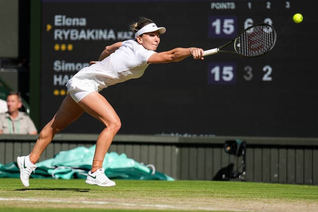 (220708) -- LONDON, July 8, 2022 -- Simona Halep of Romania hits a return during the women s singles semifinal match against Elena Rybakina of Kazakhstan at Wimbledon Tennis Championship in London, Britain, on July 7, 2022. (Photo by Xinhua) (SP)BRITAIN-LONDON-TENNIS-WIMBLEDON-WOMEN S SINGLES-SEMIFINALS ShixTang 