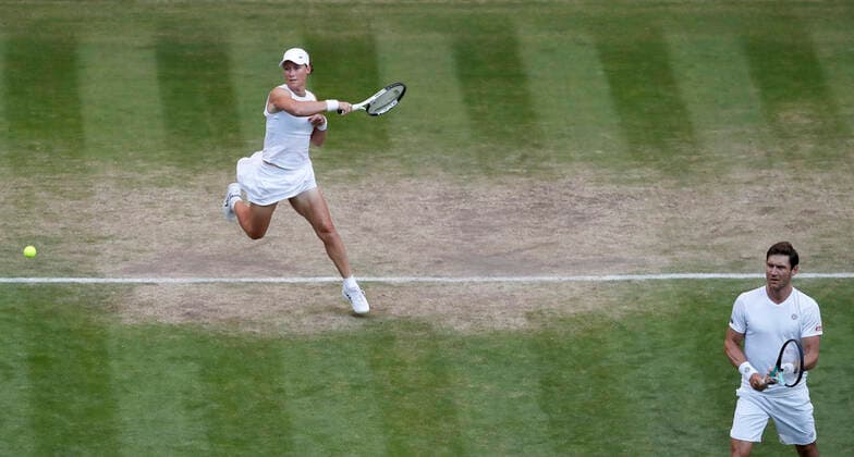 (220708) -- LONDON, July 8, 2022 -- Matthew Ebden(R) Samantha Stosur of Australia compete during the mixed doubles final against Neal Skupski of Great Britain and Desirae Krawczyk of the United States at Wimbledon Tennis Championship in London, Britain, on July 7, 2022. ) (SP)BRITAIN-LONDON-TENNIS-WIMBLEDON-MIXED DOUBLES-FINAL HanxYan 