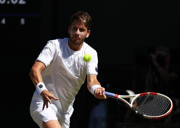 8th July 2022, All England Lawn Tennis and Croquet Club, London, England; Wimbledon Tennis tournament; Cameron Norrie (GBR) plays a forehand to Novak& xa0;Djokovic (SRB) in the mens singles semi-final  ActionPlus12406013 JohnxPatrickxFletcher