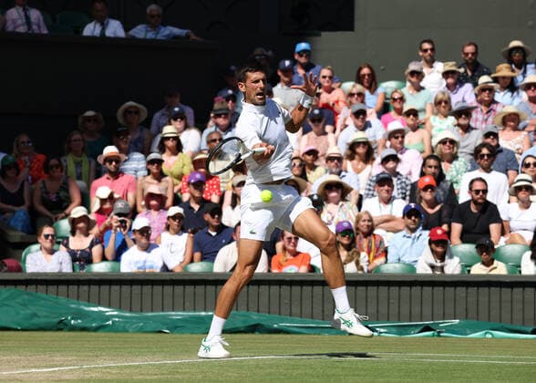 8th July 2022, All England Lawn Tennis and Croquet Club, London, England; Wimbledon Tennis tournament; Novak& xa0;Djokovic (SRB) plays a forehand to Cameron Norrie (GBR) in the mens singles semi-final match  ActionPlus12406039 JohnxPatrickxFletcher