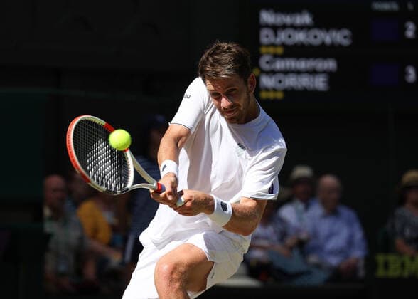 8th July 2022, All England Lawn Tennis and Croquet Club, London, England; Wimbledon Tennis tournament; Cameron Norrie (GBR) plays a backhand to Novak& xa0;Djokovic (SRB) in the mens singles semi-final match  ActionPlus12406042 JohnxPatrickxFletcher