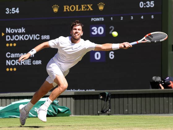 Great Britain s Cameron Norrie plays a forehand in his Semi-Final match against Serbian Novak Djokovic on day twelve of the 2022 Wimbledon championships in London on Friday, July 08, 2022. Djokovic won the match 2-6,6-3,6-2,6-4.  LON2022070817 HUGOxPHILPOTT
