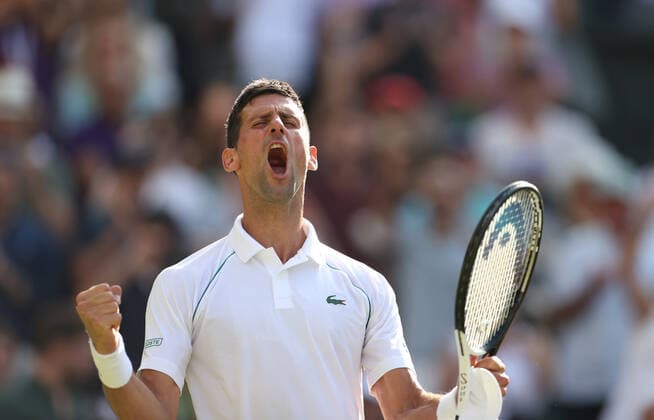 (220709) -- LONDON, July 9, 2022 -- Novak Djokovic of Serbia celebrates after winning the men s singles semifinal match against Cameron Norrie of Great Britain at Wimbledon Tennis Championship in London, Britain, on July 8, 2022. ) (SP)BRITAIN-LONDON-TENNIS-WIMBLEDON-MEN S SINGLES-SEMIFINALS LixYing 