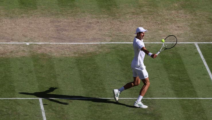 (220709) -- LONDON, July 9, 2022 -- Novak Djokovic of Serbia hits a return during the men s singles semifinal match against Cameron Norrie of Great Britain at Wimbledon Tennis Championship in London, Britain, on July 8, 2022. ) (SP)BRITAIN-LONDON-TENNIS-WIMBLEDON-MEN S SINGLES-SEMIFINALS HanxYan 