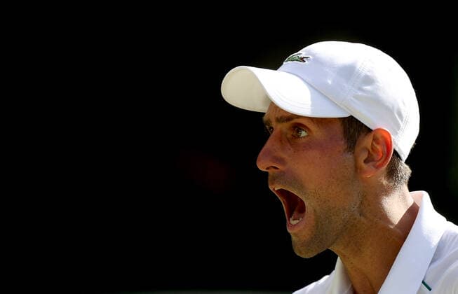 (220709) -- LONDON, July 9, 2022 -- Novak Djokovic of Serbia reacts during the men s singles semifinal match against Cameron Norrie of Great Britain at Wimbledon Tennis Championship in London, Britain, on July 8, 2022. ) (SP)BRITAIN-LONDON-TENNIS-WIMBLEDON-MEN S SINGLES-SEMIFINALS LixYing 