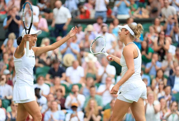 (220709) -- LONDON, July 9, 2022 -- Zhang Shuai (L) of China Elise Mertens of Belgium celebrate after winning the women s doubles semifinal match against Danielle Collins Desirae Krawczyk of the United States at Wimbledon Tennis Championship in London, Britain, on July 8, 2022. ) (SP)BRITAIN-LONDON-TENNIS-WIMBLEDON-WOMEN S DOUBLES-SEMIFINALS LixYing 