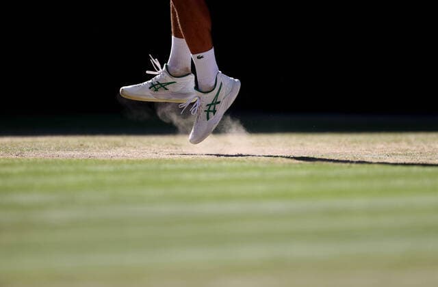 (220709) -- LONDON, July 9, 2022 -- Novak Djokovic of Serbia serves during the men s singles semifinal match against Cameron Norrie of Great Britain at Wimbledon Tennis Championship in London, Britain, on July 8, 2022. ) (SP)BRITAIN-LONDON-TENNIS-WIMBLEDON-MEN S SINGLES-SEMIFINALS LixYing 