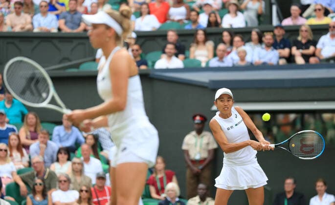 (220709) -- LONDON, July 9, 2022 -- Zhang Shuai (R) of China Elise Mertens of Belgium compete during the women s doubles semifinal match against Danielle Collins Desirae Krawczyk of the United States at Wimbledon Tennis Championship in London, Britain, on July 8, 2022. ) (SP)BRITAIN-LONDON-TENNIS-WIMBLEDON-WOMEN S DOUBLES-SEMIFINALS LixYing 