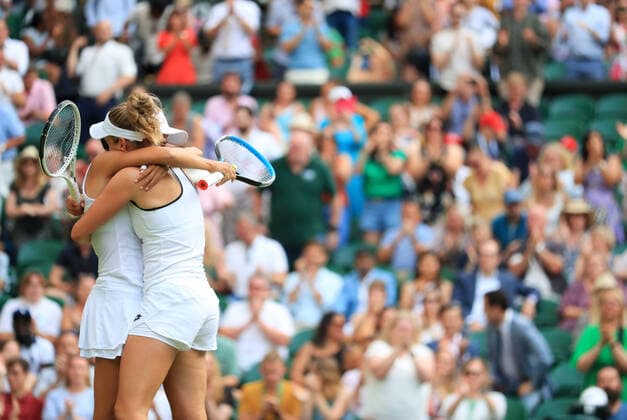 (220709) -- LONDON, July 9, 2022 -- Zhang Shuai (L) of China Elise Mertens of Belgium celebrate after winning the women s doubles semifinal match against Danielle Collins Desirae Krawczyk of the United States at Wimbledon Tennis Championship in London, Britain, on July 8, 2022. ) (SP)BRITAIN-LONDON-TENNIS-WIMBLEDON-WOMEN S DOUBLES-SEMIFINALS LixYing 