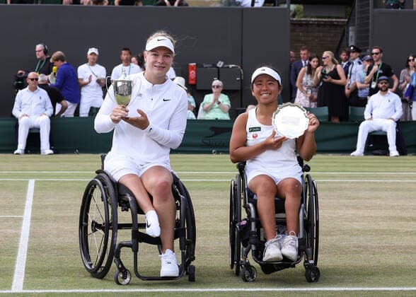 9th July 2022, All England Lawn Tennis and Croquet Club, London, England; Wimbledon Tennis tournament, ladies wheelchair singles final; Diede de Groot (NED) poses with the Ladies Wheelchair Singles Trophy alongside Yui Kamiji (JPN) who poses with the runner up plate  ActionPlus12406603 JohnxPatrickxFletcher