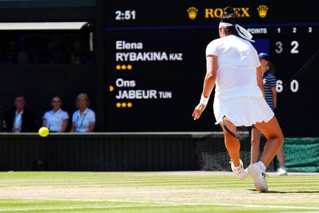 Mandatory Credit: Photo by Javier Garcia Shutterstock (13018057ao) Ons Jabeur plays the ball between her legs during the Ladies Singles Final Wimbledon Tennis Championships, Day 13, The All England Lawn Tennis and Croquet Club, London, UK - 09 Jul 2022 Wimbledon Tennis Championships, Day 13, The All England Lawn Tennis and Croquet Club, London, UK - 09 Jul 2022  Copyright: xJavierxGarcia Shutterstockx 13018057ao