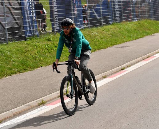 09 07 2022, Red Bull Ring , Spielberg, Formula 1 BWT Austrian Grand Prix 2022 , in picture Sebastian Vettel DEU , Aston Martin Aramco Cognizant Formula One Team arrives at the paddock by bicycle Photo EU Images Spielberg Red Bull Ring Styria Austria  eu-images-506