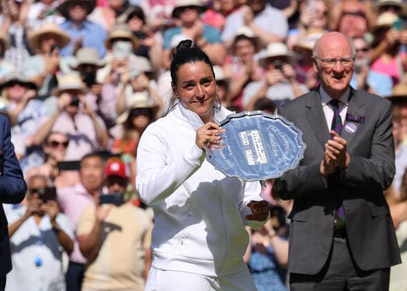 9th July 2022, All England Lawn Tennis and Croquet Club, London, England; Wimbledon Tennis tournament, womens singles final; Ons Jabeur (TUN) poses with the runners up plate  ActionPlus12406715 JohnxPatrickxFletcher