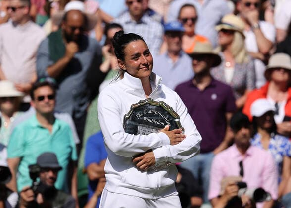 9th July 2022, All England Lawn Tennis and Croquet Club, London, England; Wimbledon Tennis tournament, womens singles final; Ons Jabeur (TUN) poses with the runners up plate  ActionPlus12406720 JohnxPatrickxFletcher