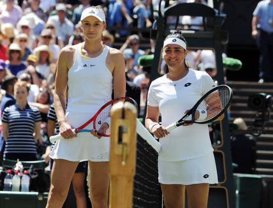 Tennis Championships - Week Two - Day Thirteen - All England Lawn Tennis Club, Wimbledon - Saturday 9th July 2022 Ladies Singles Final. Elena Rybakina (KAZ) v Ons Jabeur (TUN) Elena Rybakina (KAZ) and Ons Jabeur (TUN) at the net before the match 