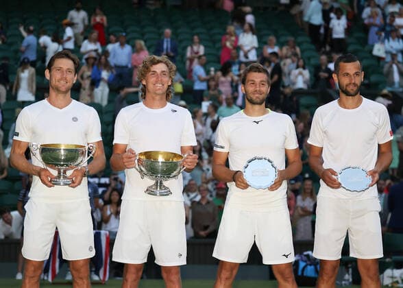 9th July 2022, All England Lawn Tennis and Croquet Club, London, England; Wimbledon Tennis tournament, womens singles final; Matthew Ebden (AUS) and Max Purcell (AUS) pose with the Gentlemen& x2019;s Doubles Trophy alongside Nikola Mektic (CRO) and Mate Pavic (CRO) who pose with the runners up plate  ActionPlus12406972 JohnxPatrickxFletcher
