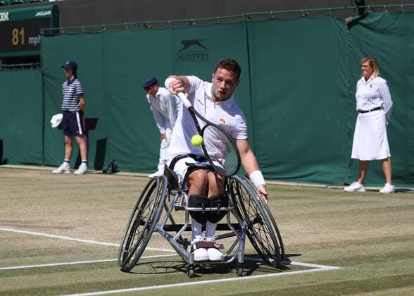 10th July 2022, All England Lawn Tennis and Croquet Club, London, England; Wimbledon Tennis tournament; Alfie Hewett (GBR) plays a backhand to Shingo Kunieda (JPN) during the mens wheelchair final  ActionPlus12407112 JohnxPatrickxFletcher
