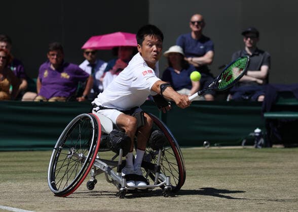 10th July 2022, All England Lawn Tennis and Croquet Club, London, England; Wimbledon Tennis tournament; Shingo Kunieda (JPN) plays a backhand to Alfie Hewett (GBR) during the mens wheelchair final  ActionPlus12407113 JohnxPatrickxFletcher