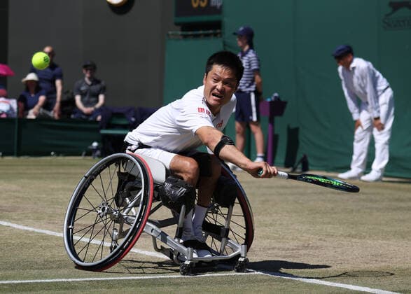 10th July 2022, All England Lawn Tennis and Croquet Club, London, England; Wimbledon Tennis tournament; Shingo Kunieda (JPN) plays a backhand to Alfie Hewett (GBR) during the mens wheelchair final  ActionPlus12407116 JohnxPatrickxFletcher