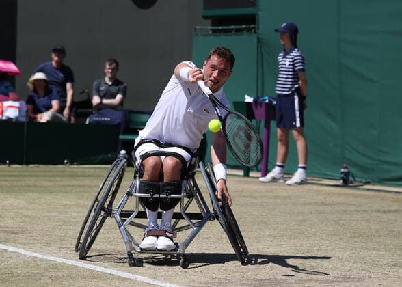 10th July 2022, All England Lawn Tennis and Croquet Club, London, England; Wimbledon Tennis tournament; Alfie Hewett (GBR) plays a backhand to Shingo Kunieda (JPN) during the mens wheelchair final  ActionPlus12407120 JohnxPatrickxFletcher