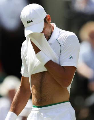 (220710) -- LONDON, July 10, 2022 -- Novak Djokovic of Serbia reacts during the men s singles final against Novak Djokovic of Serbia at Wimbledon tennis Championship in London, Britain, July 10, 2022. ) (SP)BRITAIN-LONDON-TENNIS-WIMBLEDON-MEN S SINGLES-FINAL HanxYan 