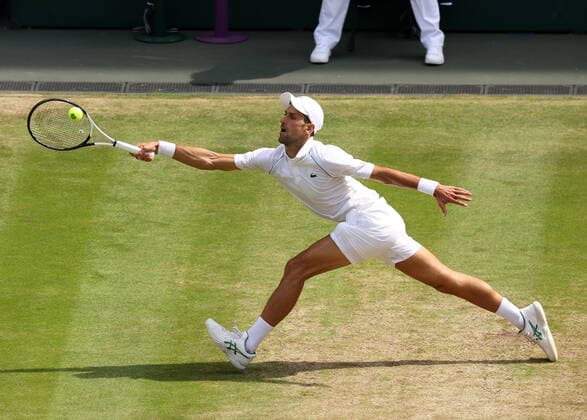 10th July 2022, All England Lawn Tennis and Croquet Club, London, England; Wimbledon Tennis tournament; Novak Djokovic (SRB) plays a forehand to Nick Kyrgios (AUS)  ActionPlus12407161 JohnxPatrickxFletcher