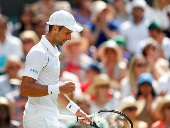 (220710) -- LONDON, July 10, 2022 -- Novak Djokovic of Serbia celebrates scoring during the men s singles final against Nick Kyrgios of Australia at Wimbledon tennis Championship in London, Britain, July 10, 2022. ) (SP) BRITAIN-LONDON-TENNIS-WIMBLEDON-MEN S SINGLES-FINAL HanxYan 